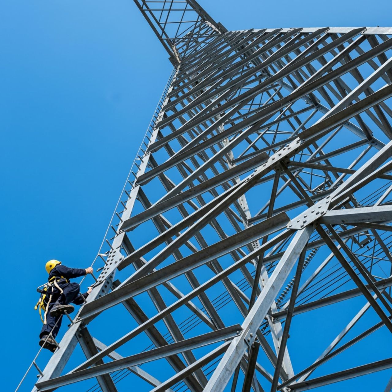 Electric pylon fall arrest systems